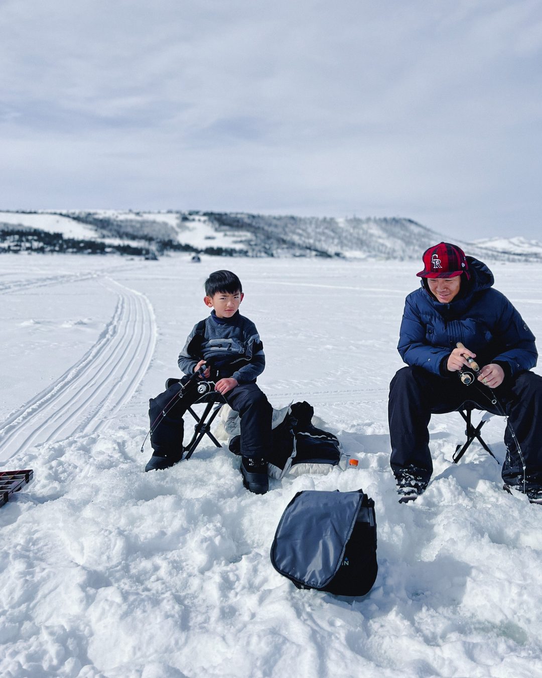 Jay Lee ice fishing with his son