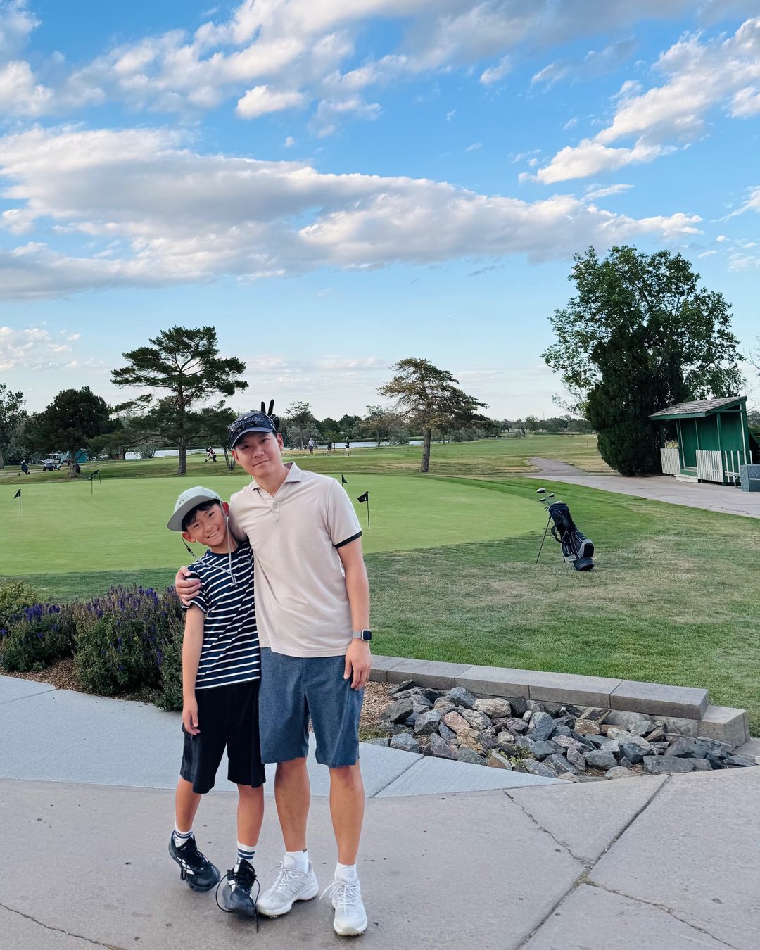 Jay Lee with his son at the golf course